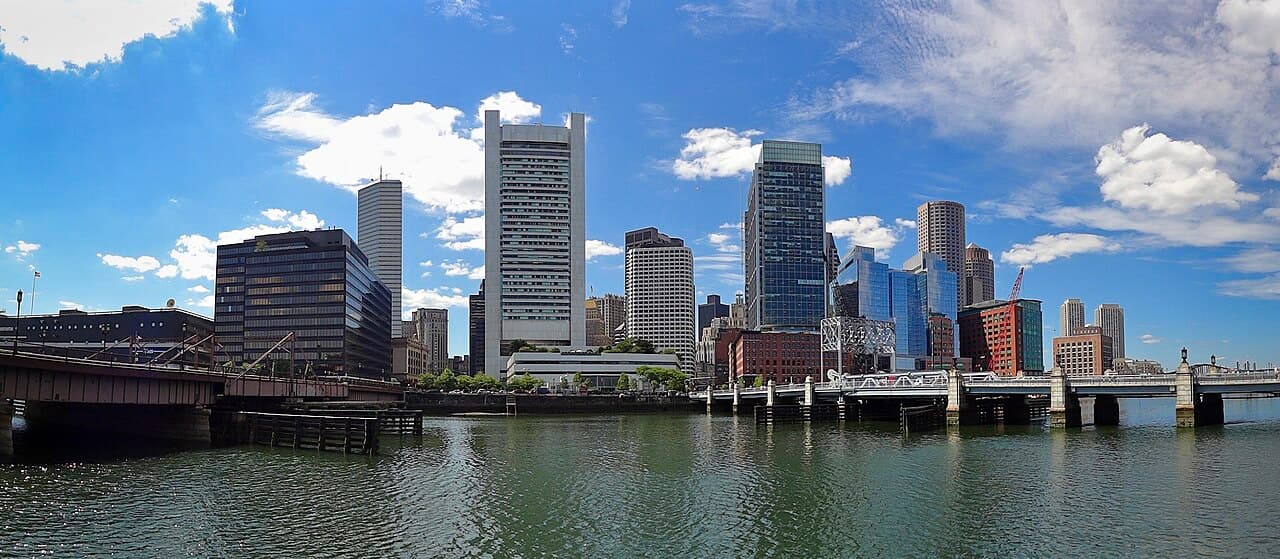 Downtown Boston's towers across Fort Point Channel, with the Summer Street bridge on the left and the Congress Street bridge on the right