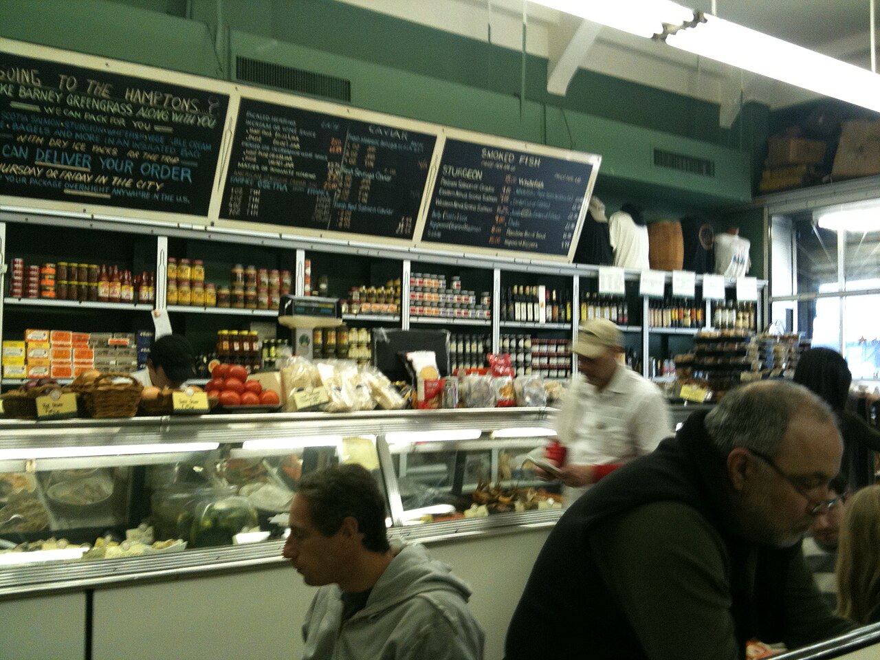 The counter at Barney Greengrass on Amsterdam Avenue, with chalkboard menus above shelves of jars