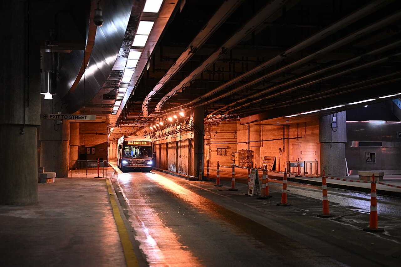 An SL2 bus signed for South Station pulling into the underground Courthouse station on the MBTA Silver Line in Boston